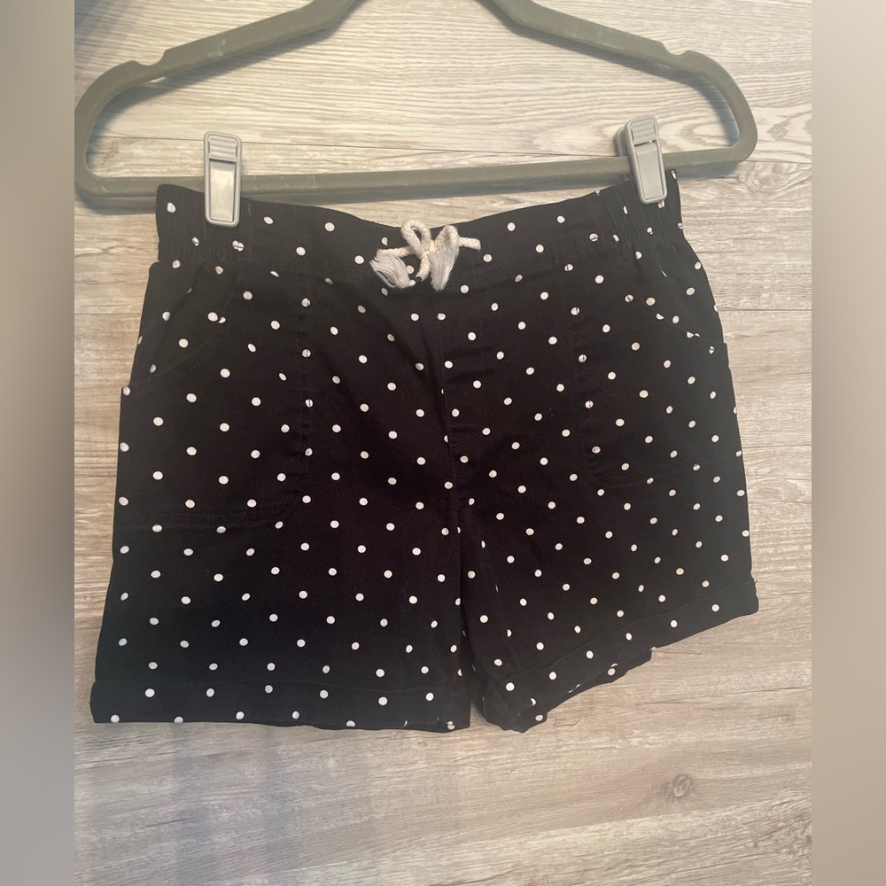 Black shorts with white polka dots